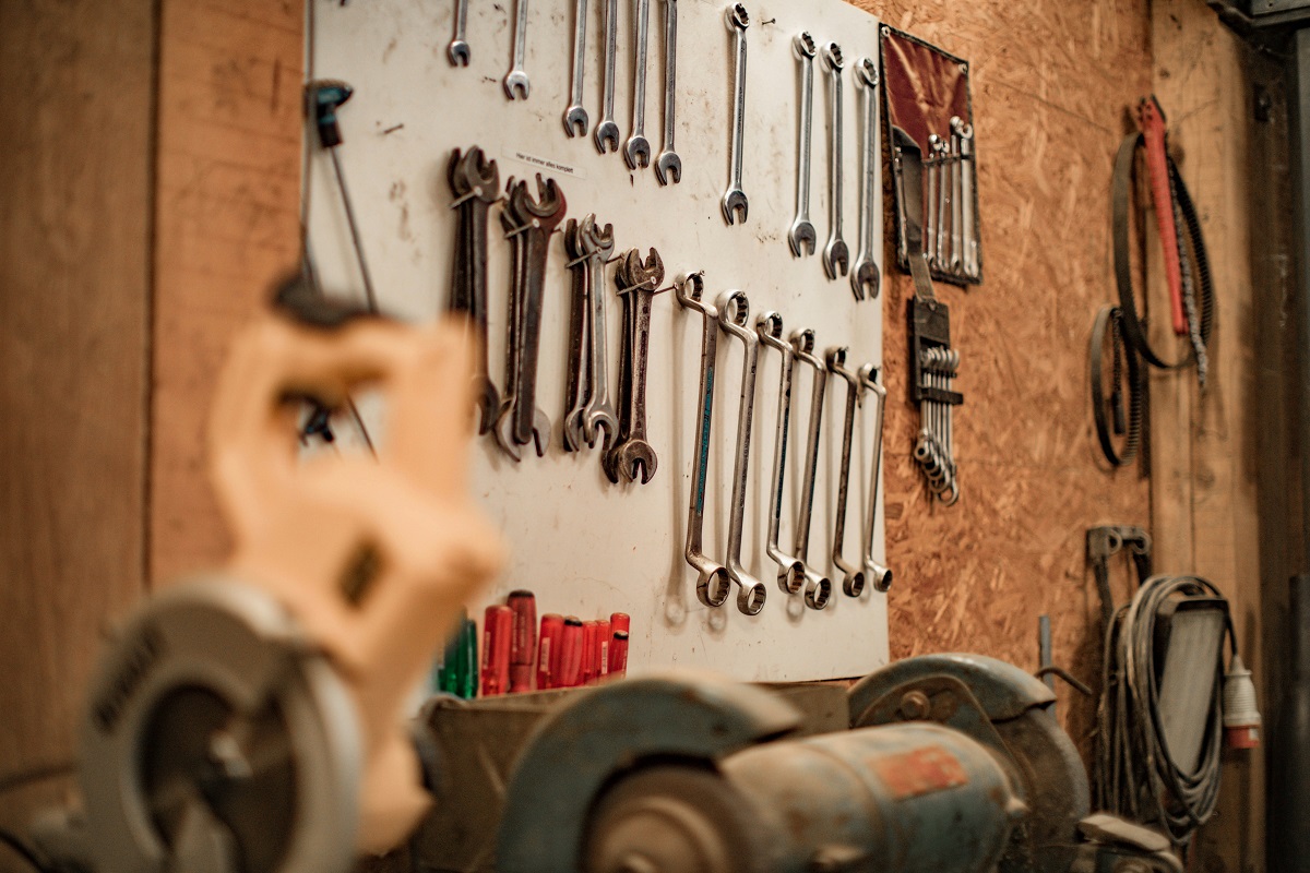 A hobbyist or home garage setup with tools and equipment for auto projects.