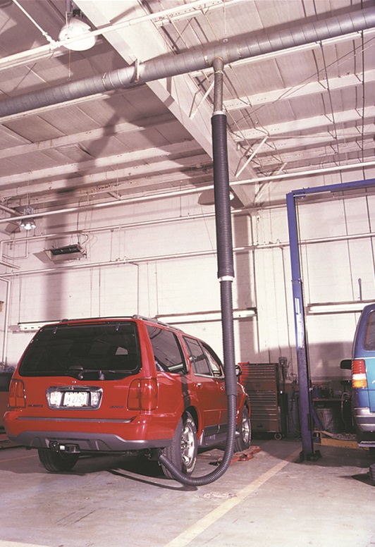 Crushroof telescoping garage exhaust removal system shown installed in a service and repair garage.