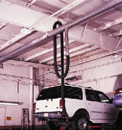 Overhead garage exhaust removal system for car dealerships.